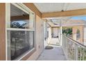 Condo hallway with access to unit, featuring a balcony at 2711 Emerald Lake Ct, Kissimmee, FL 34744