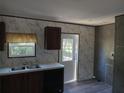 Kitchen with door leading to the backyard at 31541 Hillcrest Dr, Eustis, FL 32736