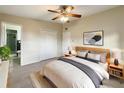 Bright bedroom with a king-size bed, large closet, and en-suite bathroom at 3700 Timber Trl, Orlando, FL 32808