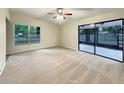 Spacious living room with sliding glass doors leading to a patio at 3700 Timber Trl, Orlando, FL 32808