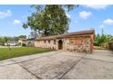 Charming stone front home with a large driveway at 6427 Sunshine St, Orlando, FL 32818