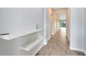 Bright entryway with floating shelves and tile flooring at 729 Hitch Loop, St Cloud, FL 34772