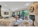 Spacious living room with fireplace, hardwood floors, and access to a patio at 1038 E Michigan St # 1, Orlando, FL 32806