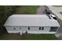 Single-wide mobile home with grey siding and AC unit at 1111 Sunflower Trl, Orlando, FL 32833