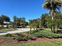 Landscaped entrance to a residential community with a gated access at 3467 Arabesque Dr, Deland, FL 32724