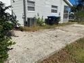 Concrete patio in need of some cleaning and repair at 502 Roger Williams Rd, Apopka, FL 32703