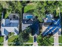 Three houses with pools, seen from above at 646 Cheoy Lee Cir, Winter Springs, FL 32708