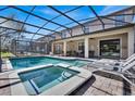 Relaxing pool and spa area with patio furniture at 1431 Thunderbird Rd, Davenport, FL 33896