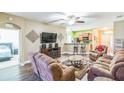 Spacious living room with brown reclining sofas and a large TV at 631 Highland Meadows St, Davenport, FL 33837