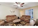 Living room with brown sofas and a coffee table, offering ample space at 631 Highland Meadows St, Davenport, FL 33837