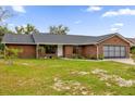 Brick ranch home with attached garage and spacious yard at 857 S Atmore Cir, Deltona, FL 32725
