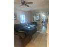 Spacious living room with sectional sofa, and view into dining area at 1241 Melontree Ct # 6, Gotha, FL 34734