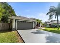 House exterior showcasing a gray garage door and driveway at 2934 Evans Dr, Kissimmee, FL 34758