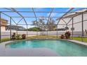 Screened-in pool with a partially visible backyard at 10760 Emerald Chase Dr, Orlando, FL 32836