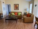 Living room featuring a comfortable sofa and coffee table at 2202 Key West Ct # 632, Kissimmee, FL 34741