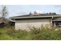 Brick home side view, showing a garage at 3555 E Johnson Ave, Haines City, FL 33844