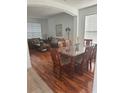 Dining area with hardwood floors and a view into the living room at 4704 Delray Beach Ct, Kissimmee, FL 34746