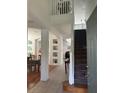 Two-story foyer with hardwood floors and a staircase at 4704 Delray Beach Ct, Kissimmee, FL 34746