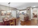 Kitchen and dining area with hardwood floors and modern lighting at 3214 Gold Ln, Kissimmee, FL 34747
