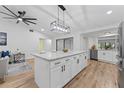 Updated kitchen with island, stainless steel appliances, and hardwood floors at 5016 Dorman Rd, Lakeland, FL 33813