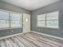 Bright entryway with new flooring and neutral walls at 143 N Woodward Ave, Deland, FL 32720