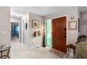 Bright and spacious entryway with tile floors and wooden door at 47 Community Dr, Debary, FL 32713