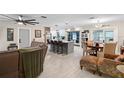 Open concept kitchen with island and dining area at 47 Community Dr, Debary, FL 32713