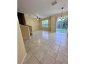 Open living room with tile floors and access to the patio at 6430 S Goldenrod Rd # 15B, Orlando, FL 32822