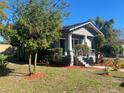 Gray house with a front porch, landscaping, and walkway at 1019 W Jefferson St, Orlando, FL 32805