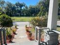 Brick walkway leading to charming house with mature trees at 1019 W Jefferson St, Orlando, FL 32805