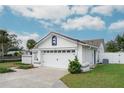 White two-car garage with a white door at 1420 Moorland Ct, Longwood, FL 32750