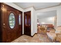 Elegant entryway with tiled floors and a view into the living room at 172 Sheridan Ave, Longwood, FL 32750