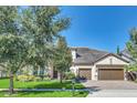 Two-story house with a large front yard and mature trees at 8441 Chilton Dr, Orlando, FL 32836