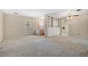 Spacious living room featuring a built-in cabinet and carpet flooring at 648 Worthington Dr, Winter Park, FL 32789