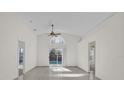 Bright living room with tile floors, vaulted ceiling and sliding doors to the pool at 2238 Wyndam Way, Kissimmee, FL 34743