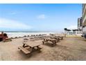 Beachfront picnic tables and lounge chairs at 3727 S Atlantic Ave # 3270, Daytona Beach, FL 32118