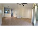 Spacious living room with tile flooring and access to the patio at 3660 Wilshire Way Rd # 260, Orlando, FL 32829