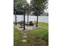 Cozy patio with pergola, seating, and a fenced yard at 378 Southern Charm Dr, Orlando, FL 32807