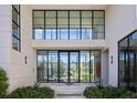 Stylish entryway with a large glass door and sleek design at 10036 Hyperion Ln, Orlando, FL 32836