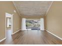 Spacious living room with wood-look flooring and sliding glass doors at 1084 Villa Ln # 72, Apopka, FL 32712