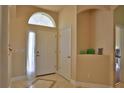 Bright and spacious entryway with tile flooring and neutral walls at 3555 Maribella Dr, New Smyrna Beach, FL 32168