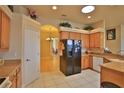Well-equipped kitchen featuring wood cabinets and granite countertops at 3555 Maribella Dr, New Smyrna Beach, FL 32168