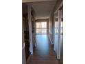 Bright and spacious entryway with wood-look flooring and mirrored closet doors at 2860 N Powers Dr # 8, Orlando, FL 32818