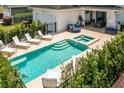 Inviting rectangular pool with spa and lounge area at 7423 Sparkling Ct, Reunion, FL 34747