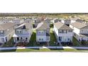Row of townhouses viewed from above, showcasing the community layout at 4704 Homestead Trl, St Cloud, FL 34772
