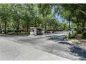 Gated community entrance with security access at 7135 Yacht Basin Ave # 237, Orlando, FL 32835