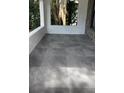 Spacious tiled porch, perfect for relaxing outdoors at 221 N Julia Ave, Deland, FL 32720
