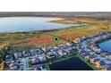 Aerial view showing home location in a neighborhood near a lake at 2609 Mead Ave, St Cloud, FL 34771