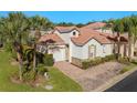 Aerial view of villa, showcasing the roofline and landscaping at 404 Brunello Dr, Davenport, FL 33897
