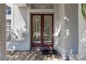 Inviting entryway with double doors and a tiled porch at 1178 Black Walnut Ct, Winter Springs, FL 32708